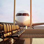 Inside an airport with plane outside